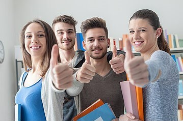 Students showing thumbs up