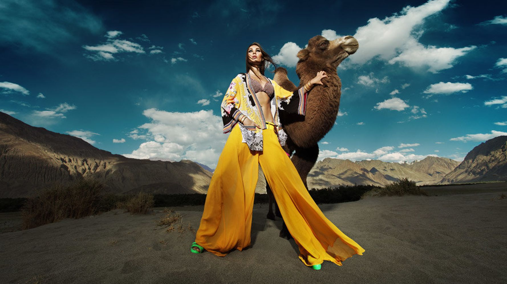 Model posing with camel